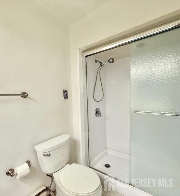 54 Amberly Dr Unit A, Manalapan, NJ 07726 - bathroom with a stall shower and toilet
