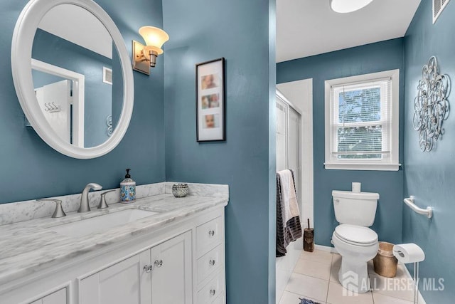 full bathroom featuring visible vents, a shower with shower door, tile patterned floors, vanity, and toilet