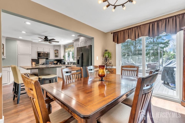 dining space featuring recessed lighting, a ceiling fan, and light wood finished floors