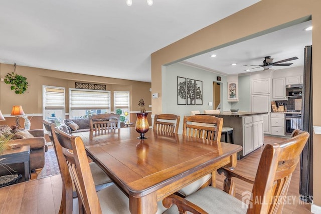 dining area with recessed lighting, a ceiling fan, and light wood finished floors
