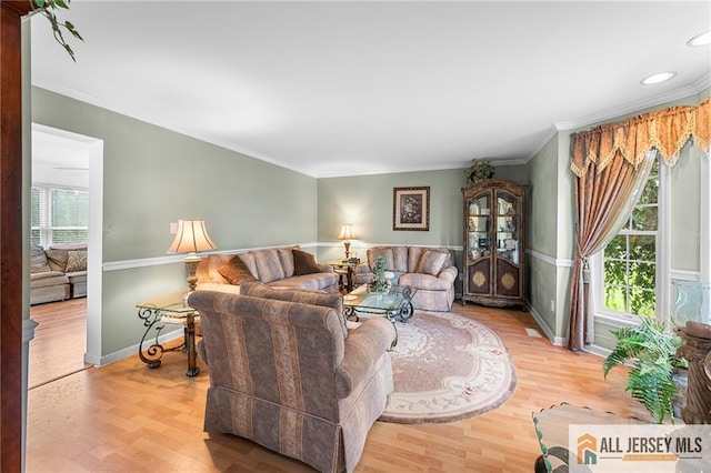 254 Wyoming Ave, Spotswood, NJ 08884 - living area featuring wood finished floors, crown molding, and recessed lighting