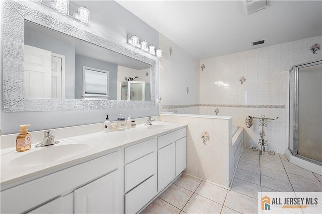 254 Wyoming Ave, Spotswood, NJ 08884 - bathroom featuring a stall shower, tile patterned flooring, a garden tub, and double vanity