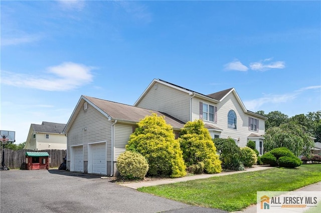 254 Wyoming Ave, Spotswood, NJ 08884 - view of property exterior featuring driveway and a garage