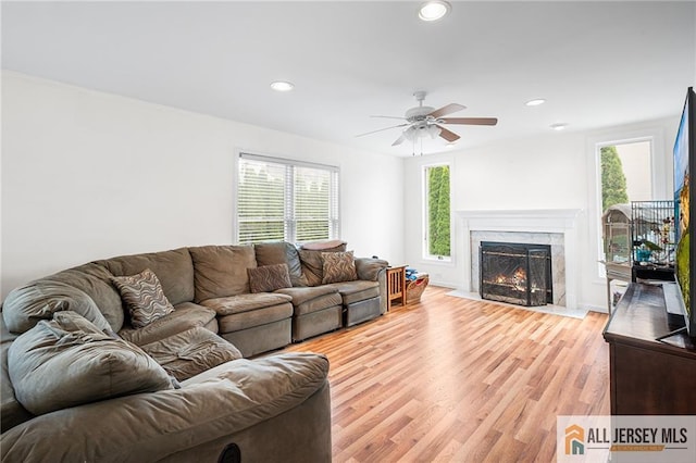 254 Wyoming Ave, Spotswood, NJ 08884 - living area featuring plenty of natural light, a ceiling fan, recessed lighting, a fireplace, and light wood-style flooring