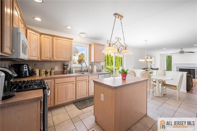 254 Wyoming Ave, Spotswood, NJ 08884 - kitchen featuring light brown cabinetry, white appliances, tasteful backsplash, a center island, and recessed lighting