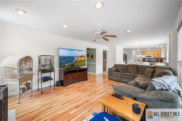 254 Wyoming Ave, Spotswood, NJ 08884 - living area featuring light wood-style floors, a ceiling fan, and recessed lighting