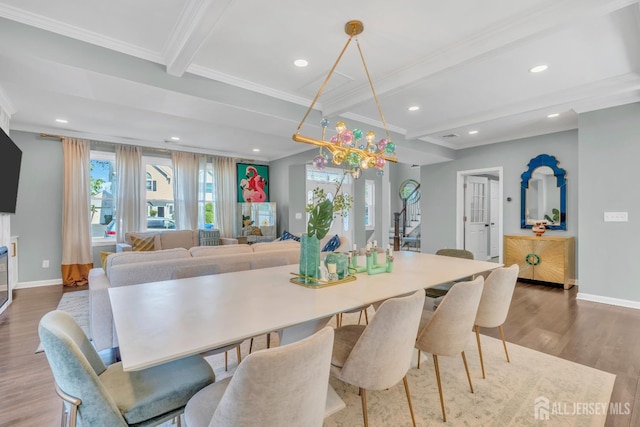 dining area featuring ornamental molding, baseboards, beam ceiling, wood finished floors, and recessed lighting