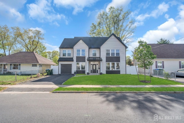 view of front of home with driveway and an attached garage