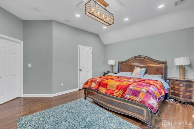 bedroom featuring wood finished floors, baseboards, recessed lighting, and vaulted ceiling