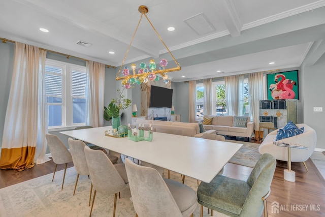 dining area featuring ornamental molding, wood finished floors, recessed lighting, baseboards, and beamed ceiling