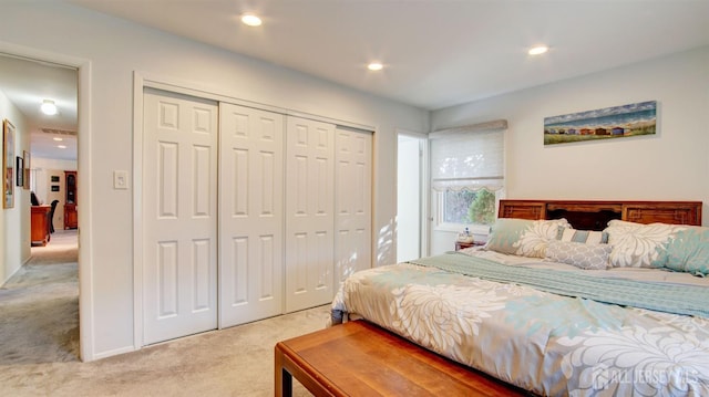 carpeted bedroom with a closet