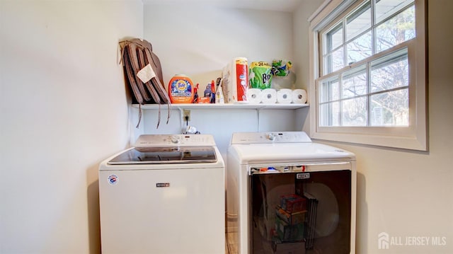 clothes washing area featuring washing machine and clothes dryer