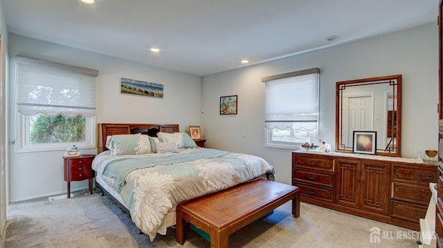 bedroom featuring light colored carpet