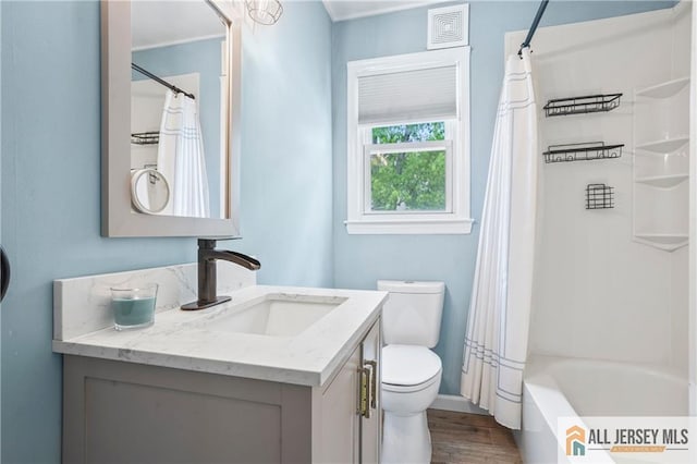 36 George Ave, Old Bridge, NJ 08857 - bathroom with vanity, toilet, wood finished floors, shower / bath combo, and baseboards
