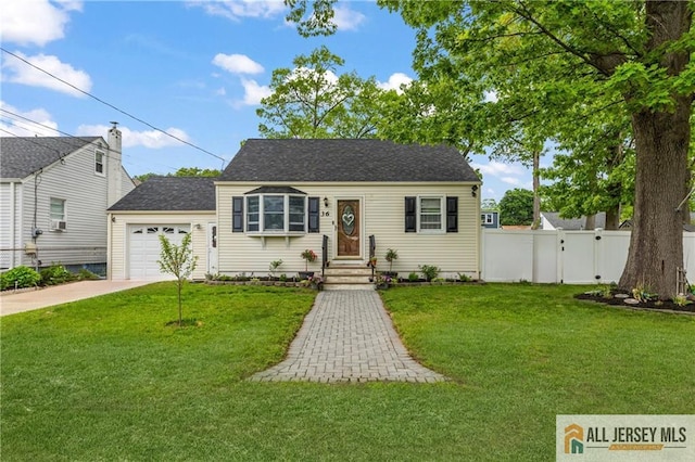 36 George Ave, Old Bridge, NJ 08857 - view of front of property with concrete driveway, an attached garage, and a shingled roof