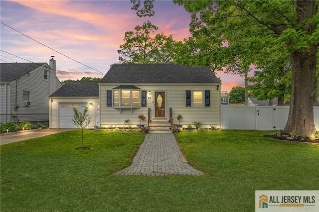36 George Ave, Old Bridge, NJ 08857 - view of front of home with concrete driveway, a gate, an attached garage, and a shingled roof