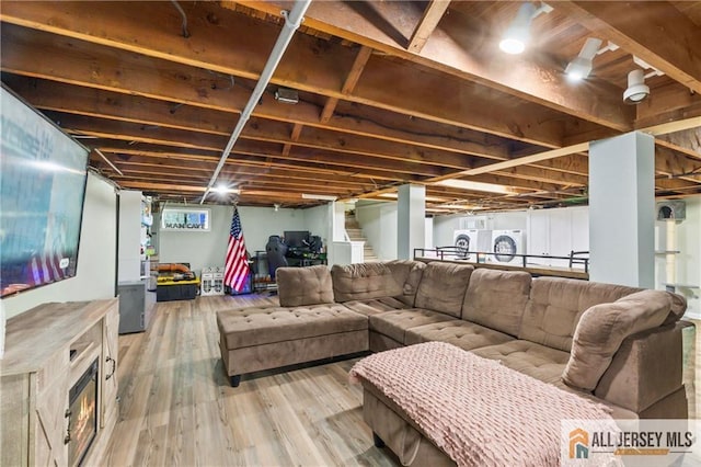 36 George Ave, Old Bridge, NJ 08857 - living room featuring light wood-style floors and washer and dryer