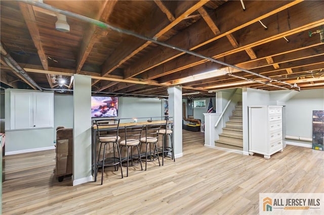 36 George Ave, Old Bridge, NJ 08857 - finished below grade area featuring a bar, stairs, baseboards, and wood finished floors