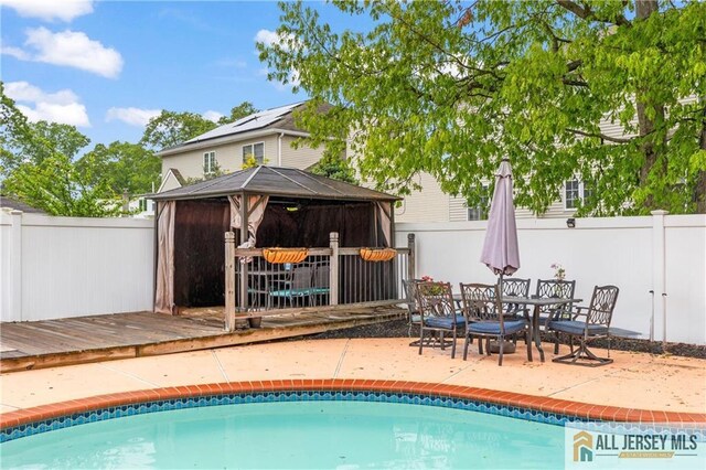 36 George Ave, Old Bridge, NJ 08857 - view of pool featuring a gazebo, a fenced backyard, a patio area, and a deck