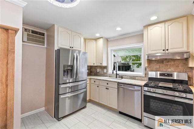 36 George Ave, Old Bridge, NJ 08857 - kitchen featuring appliances with stainless steel finishes, under cabinet range hood, a sink, an AC wall unit, and cream cabinets