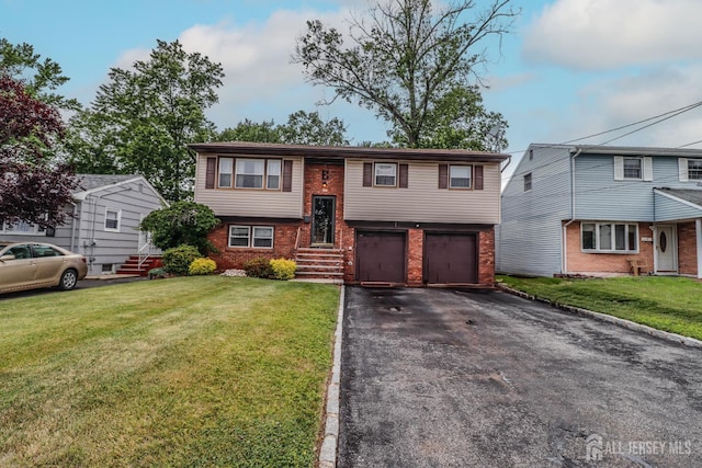 104 Elizabeth Ave, Iselin, NJ 08830 - bi-level home featuring brick siding, asphalt driveway, a garage, and a front yard