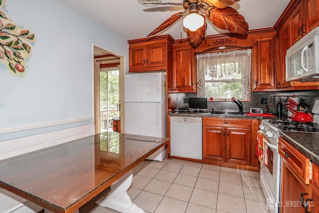 104 Elizabeth Ave, Iselin, NJ 08830 - kitchen with white appliances, ceiling fan, dark countertops, tasteful backsplash, and plenty of natural light