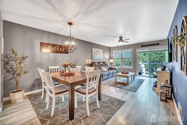 122 Concordia Cir Unit B, Monroe, NJ 08831 - dining room featuring ceiling fan, wood finished floors, baseboards, and a chandelier