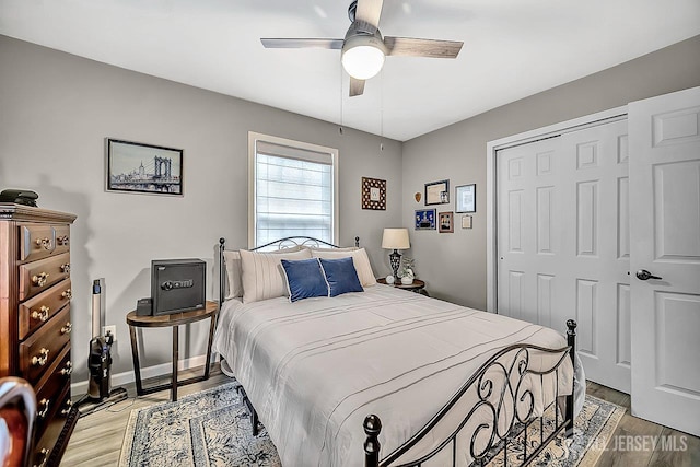 122 Concordia Cir Unit B, Monroe, NJ 08831 - bedroom featuring a closet, light wood-type flooring, a ceiling fan, and baseboards