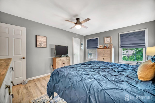 122 Concordia Cir Unit B, Monroe, NJ 08831 - bedroom featuring light wood-style flooring, baseboards, and a ceiling fan