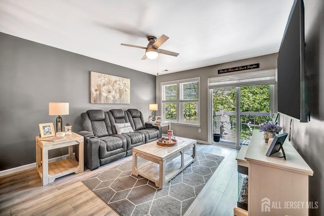 122 Concordia Cir Unit B, Monroe, NJ 08831 - living area with ceiling fan, light wood finished floors, and baseboards