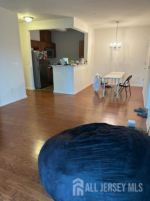 533 E Celebration Way S, Plainfield, NJ 07080 - living area with dark wood finished floors and a chandelier
