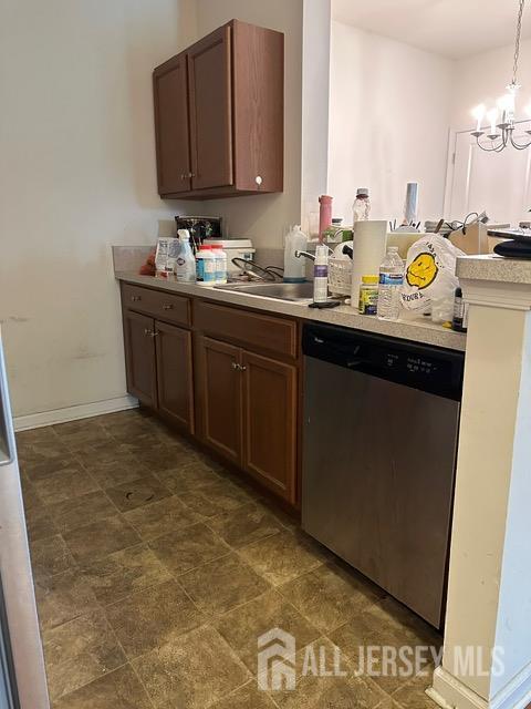 533 E Celebration Way S, Plainfield, NJ 07080 - kitchen featuring stainless steel dishwasher, light countertops, a chandelier, pendant lighting, and a peninsula