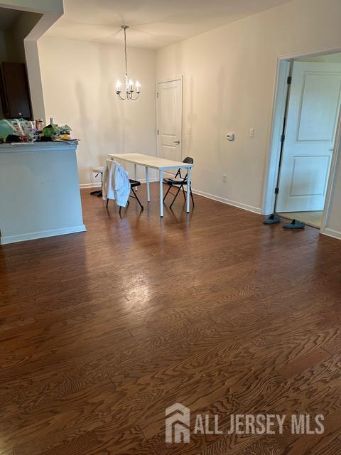 533 E Celebration Way S, Plainfield, NJ 07080 - unfurnished dining area featuring dark wood-style flooring and a chandelier