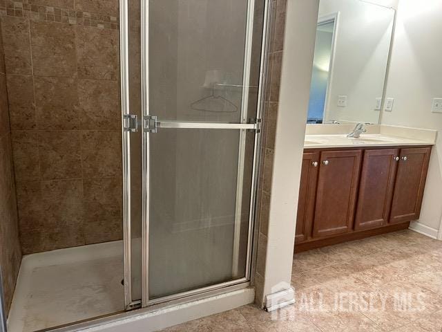 533 E Celebration Way S, Plainfield, NJ 07080 - bathroom with vanity, a stall shower, and tile patterned floors