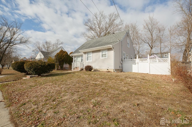 view of home's exterior featuring a yard