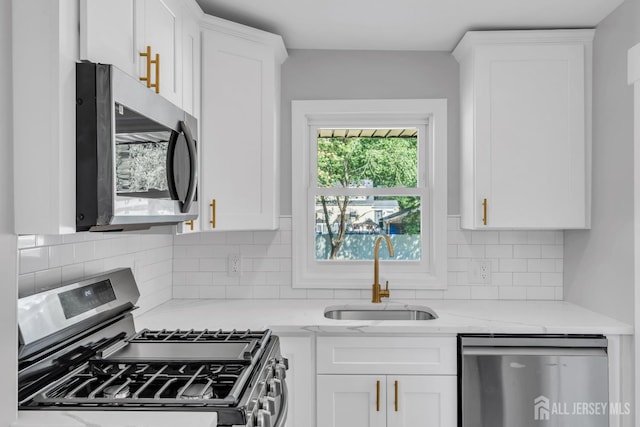 97 Battle Hill Ave, Springfield, NJ 07081 - kitchen with stainless steel appliances, white cabinets, and decorative backsplash