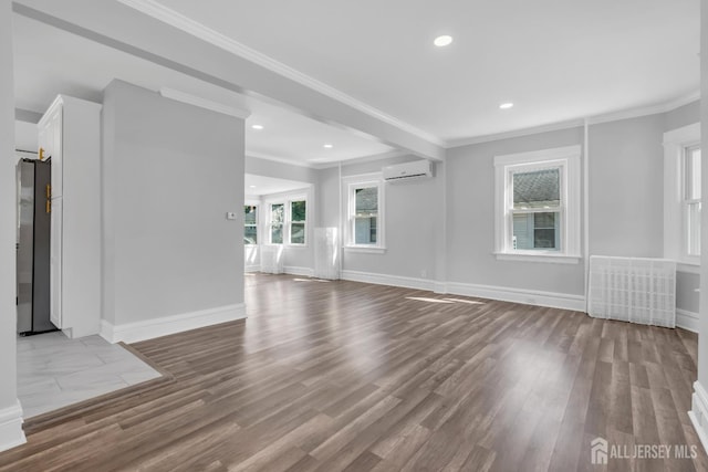 97 Battle Hill Ave, Springfield, NJ 07081 - unfurnished living room featuring a wall unit AC, ornamental molding, wood finished floors, recessed lighting, and radiator