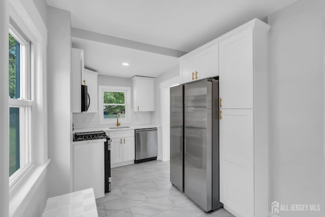 97 Battle Hill Ave, Springfield, NJ 07081 - kitchen featuring stainless steel appliances, light marble finish flooring, white cabinetry, light countertops, and recessed lighting