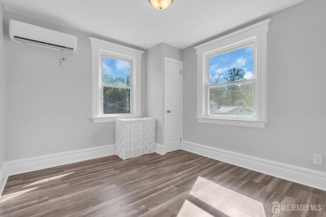 97 Battle Hill Ave, Springfield, NJ 07081 - unfurnished bedroom with a wall mounted AC and wood finished floors