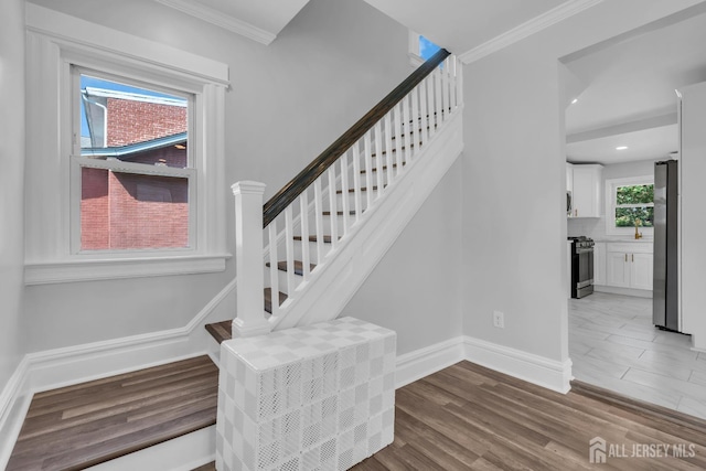97 Battle Hill Ave, Springfield, NJ 07081 - stairs with ornamental molding, wood finished floors, and recessed lighting