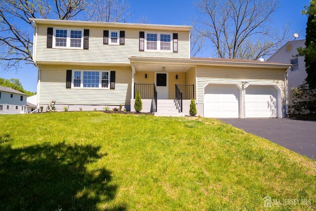 4 Harvey Rd, South Brunswick, NJ 08852 - view of front facade with driveway, a garage, and a front yard