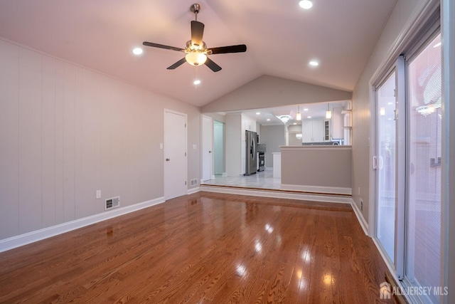 4 Harvey Rd, South Brunswick, NJ 08852 - unfurnished living room with a ceiling fan, wood finished floors, and vaulted ceiling