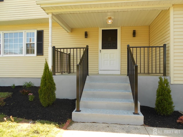 4 Harvey Rd, South Brunswick, NJ 08852 - view of exterior entry featuring a porch
