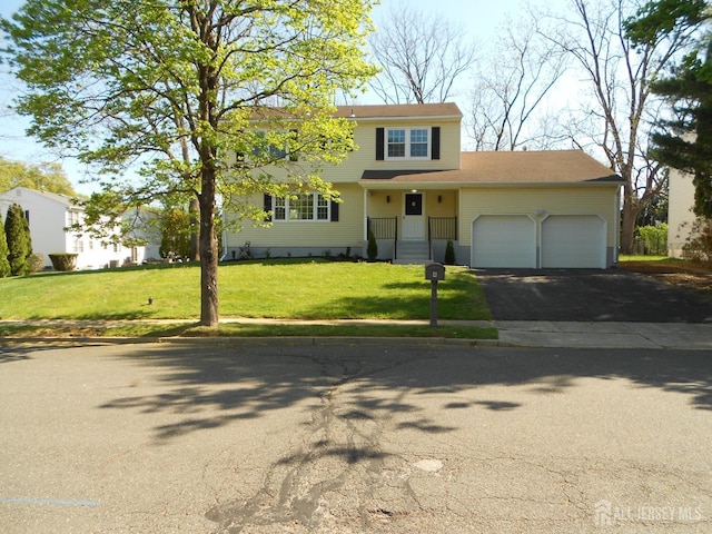 4 Harvey Rd, South Brunswick, NJ 08852 - view of front facade with an attached garage, driveway, and a front yard