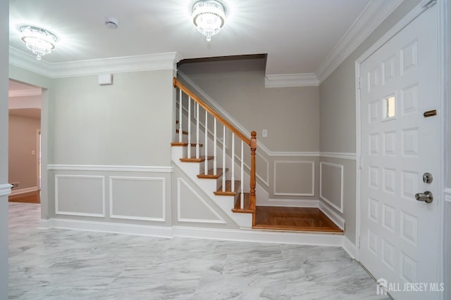 4 Harvey Rd, South Brunswick, NJ 08852 - entrance foyer featuring a decorative wall, marble look tile flooring, crown molding, wainscoting, and stairway
