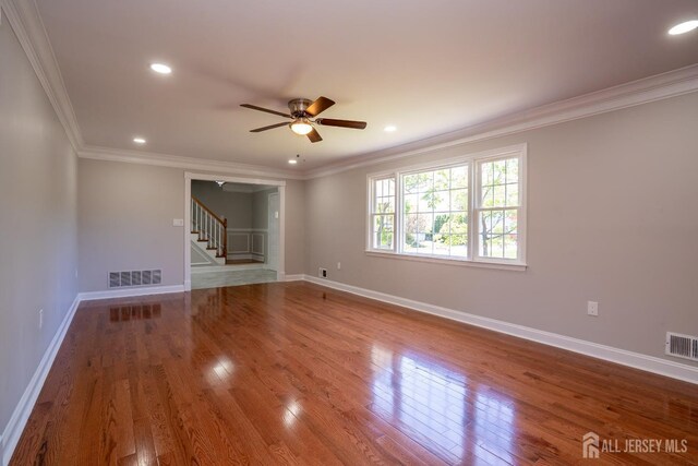 4 Harvey Rd, South Brunswick, NJ 08852 - unfurnished room with stairs, wood finished floors, ceiling fan, crown molding, and baseboards