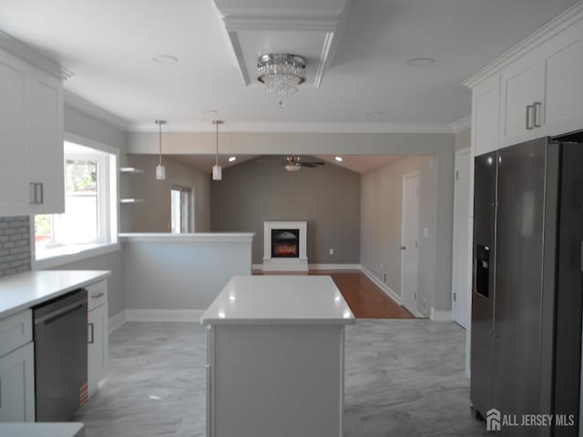 4 Harvey Rd, South Brunswick, NJ 08852 - kitchen featuring stainless steel fridge, dishwasher, ceiling fan, white cabinets, and a warm lit fireplace