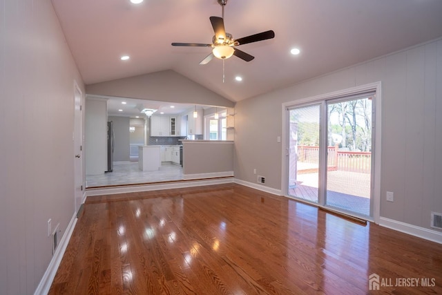 4 Harvey Rd, South Brunswick, NJ 08852 - unfurnished living room featuring light wood-style floors, vaulted ceiling, a ceiling fan, baseboards, and recessed lighting