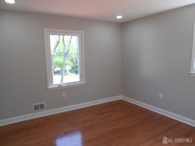 4 Harvey Rd, South Brunswick, NJ 08852 - unfurnished room featuring dark wood-style flooring, recessed lighting, and baseboards