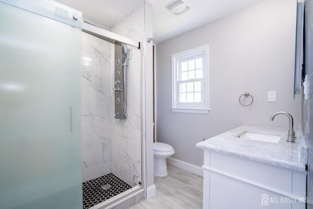 4 Harvey Rd, South Brunswick, NJ 08852 - bathroom featuring a marble finish shower, toilet, vanity, and baseboards